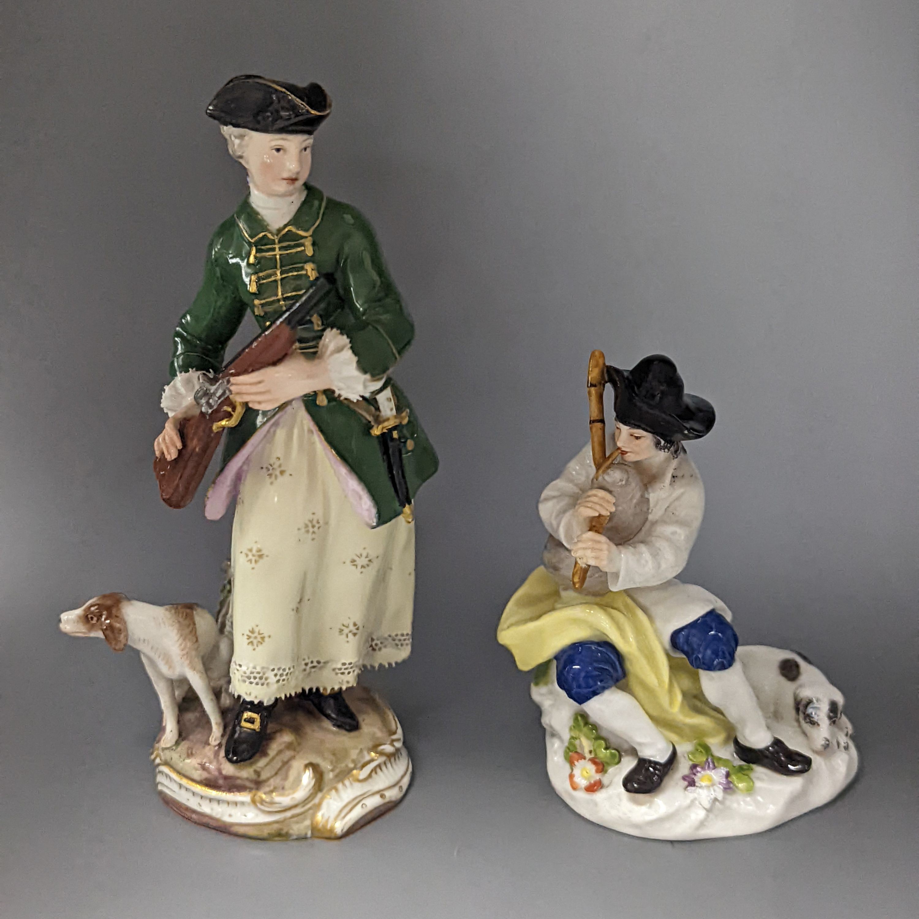 A Meissen figure of a seated man playing the bagpipes, 8.5cm., and a similar group of a huntswoman with a hound, 13cm., late 19th century, 8.5 cm and 13 cm high, some restoration